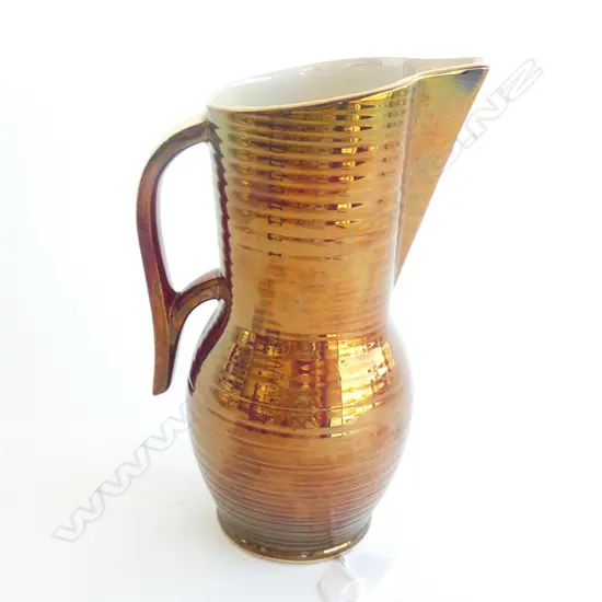 A Crown Devon rouge royale flower ewer.